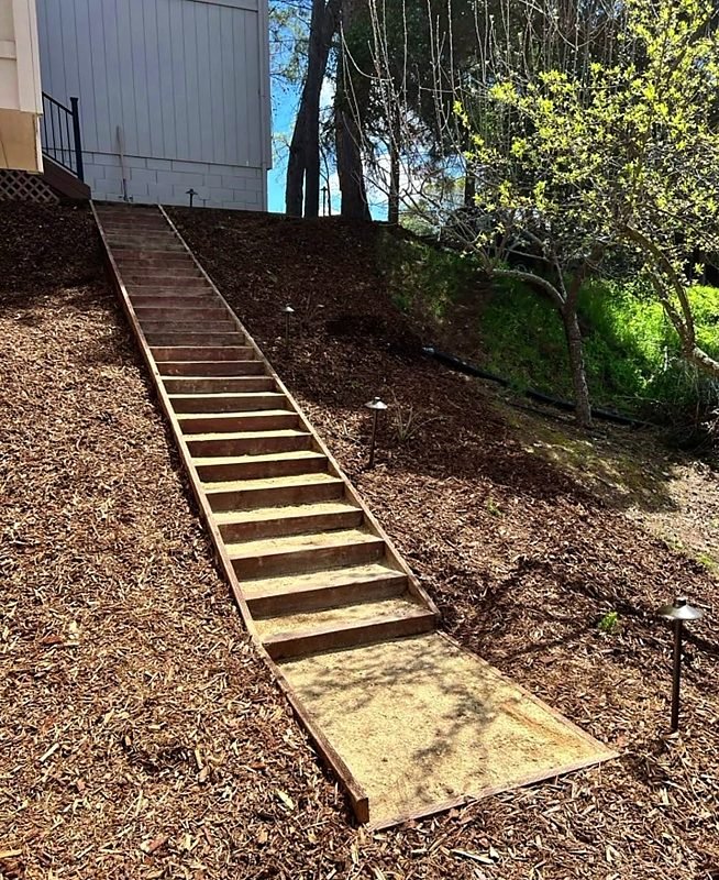 Timber steps up a steep mulched slope