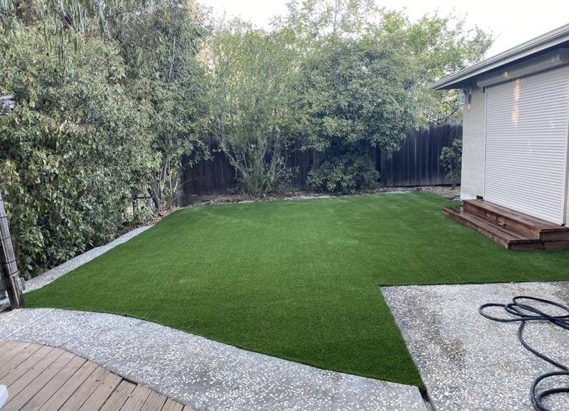 Artificial turf inside an exposed aggregate border