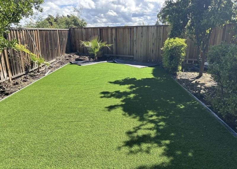 New artificial turf backyard with clean edges