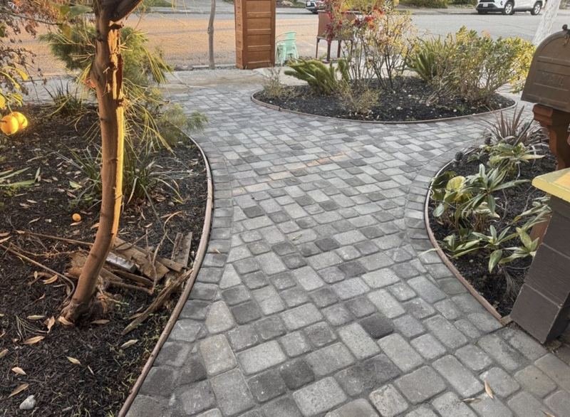 Cobblestone walkway and planting beds